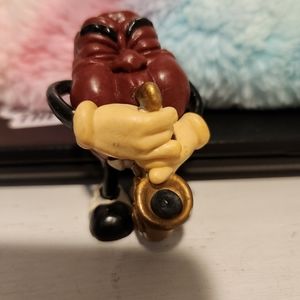 Vintage California Raisin saxophone player.